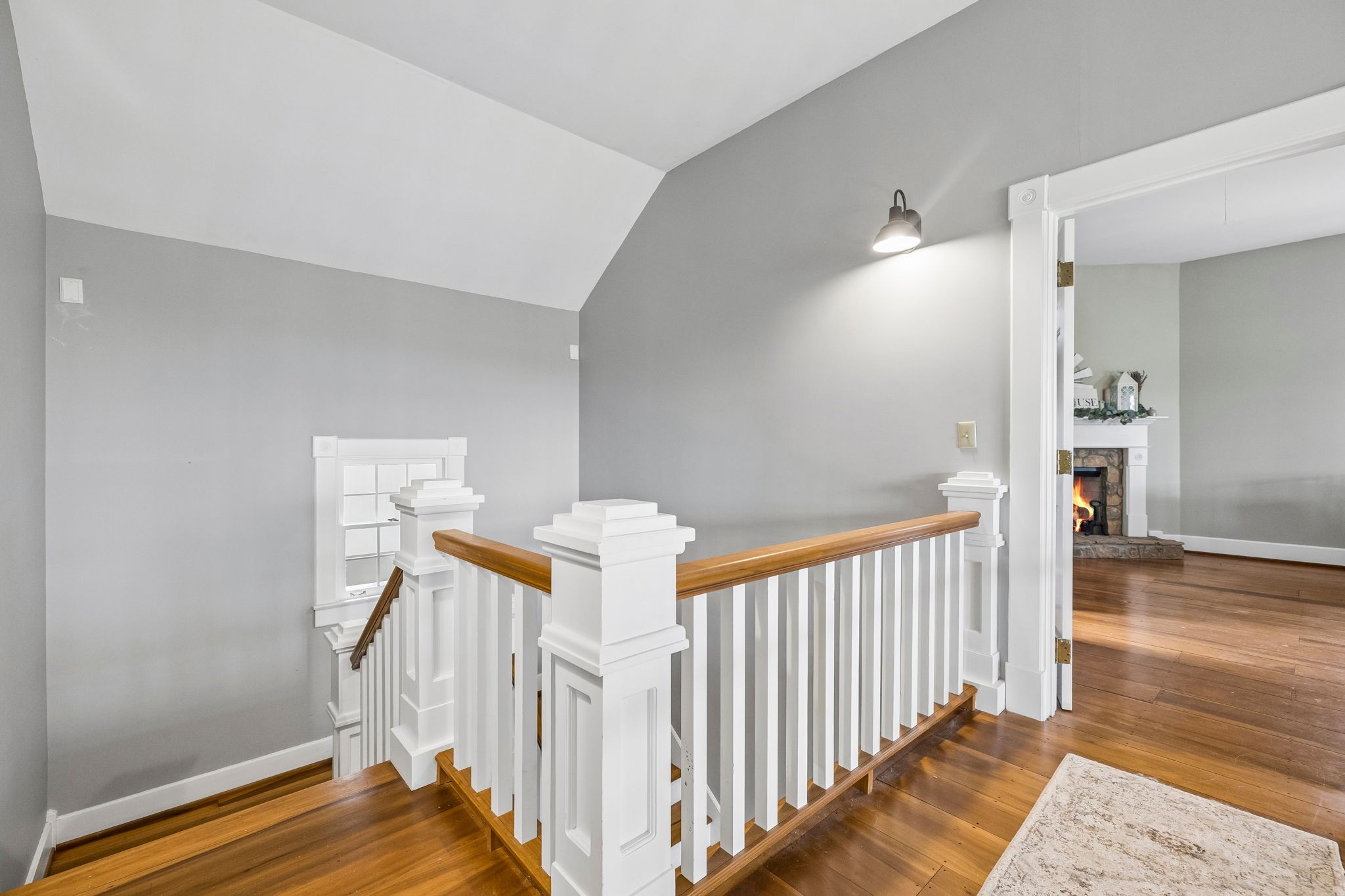901 Town Branch Road Charlotte, TN 37036 - Photo 20 of 66 a view of a hallway to a livingroom with wooden floor and stairs