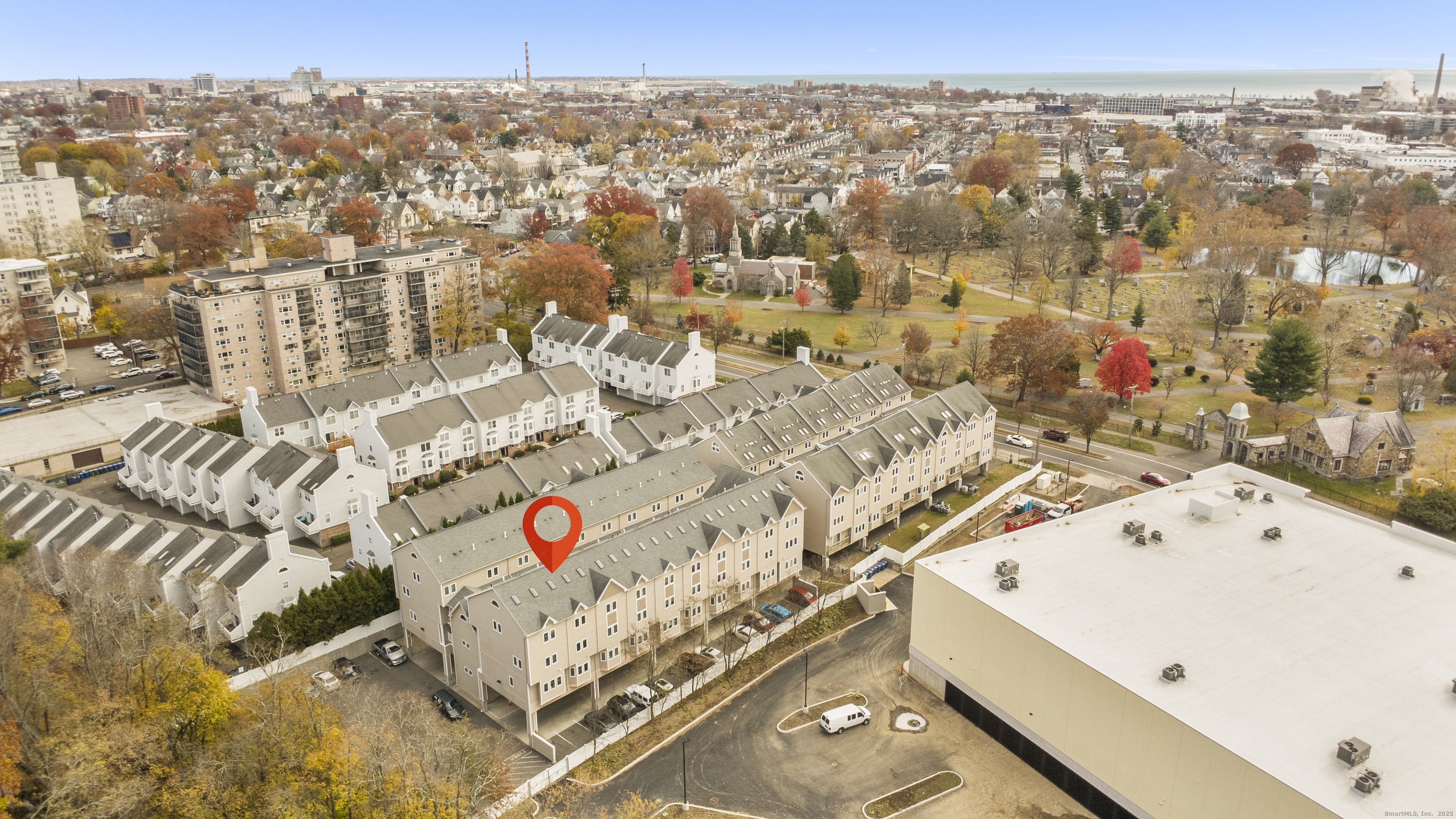an aerial view of residential house with parking