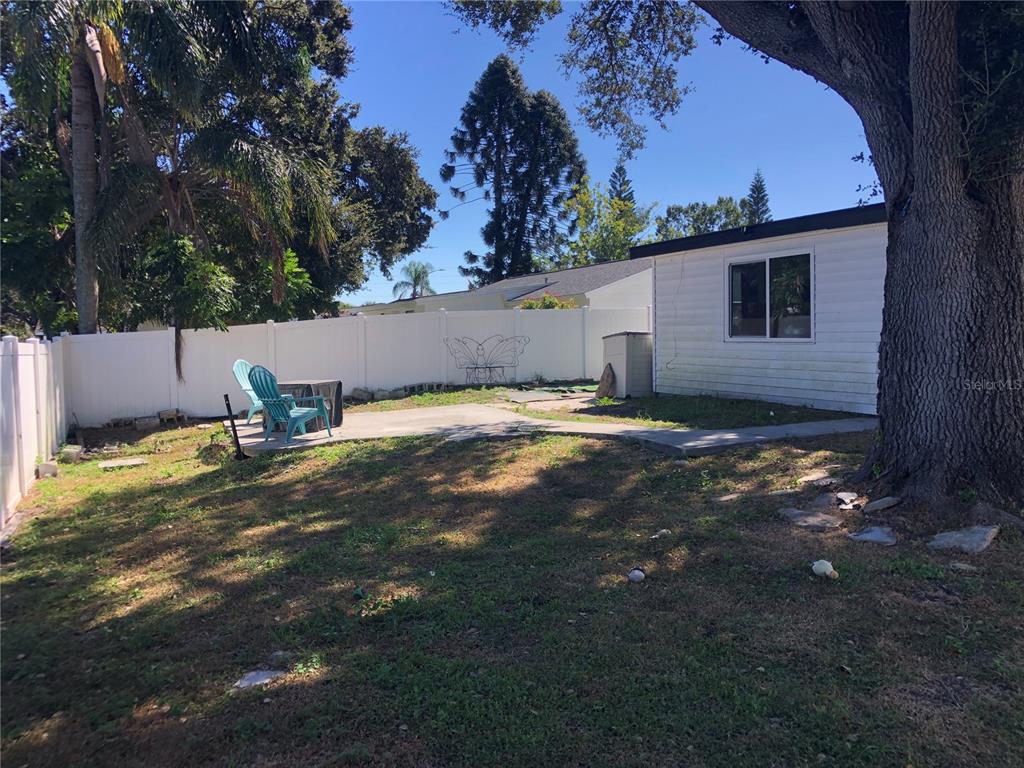 6425 Reno Avenue New Port Richey, FL 34653 - Photo 3 of 17 a view of a backyard of the house