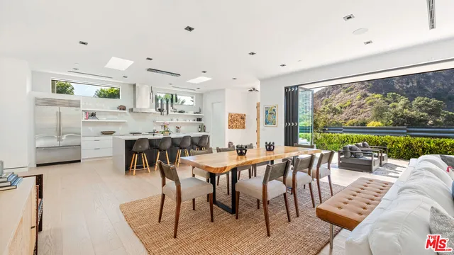 a view of a dining room with furniture window and outside view