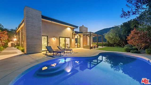 a view of a house with swimming pool