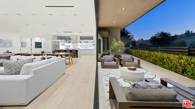 a living room with furniture fireplace and city view