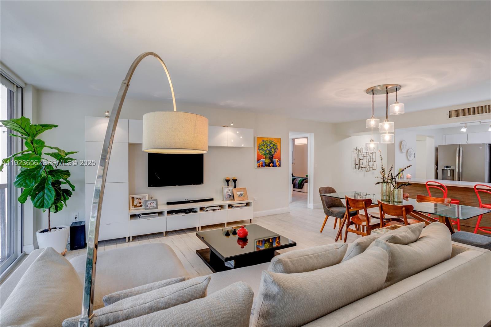 55 Ocean Ln Drive, Unit 2033 Key Biscayne, FL 33149 - Photo 4 of 21 a living room with furniture and a flat screen tv