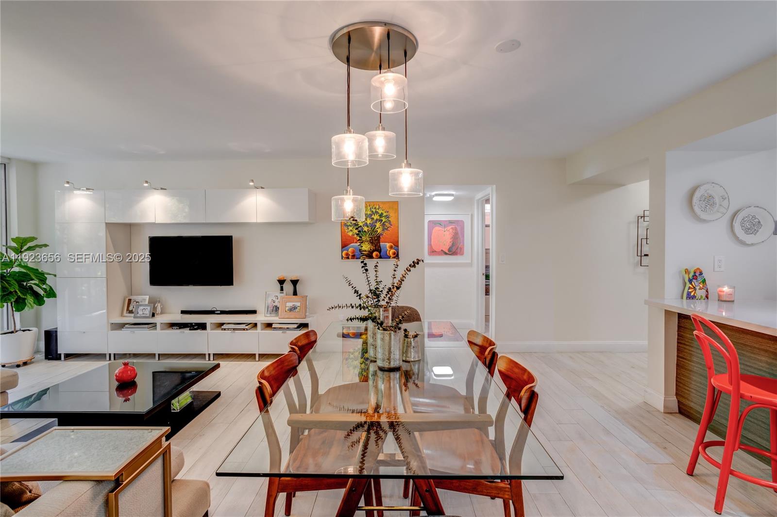 55 Ocean Ln Drive, Unit 2033 Key Biscayne, FL 33149 - Photo 5 of 21 a view of a dining room with furniture and a flat screen tv