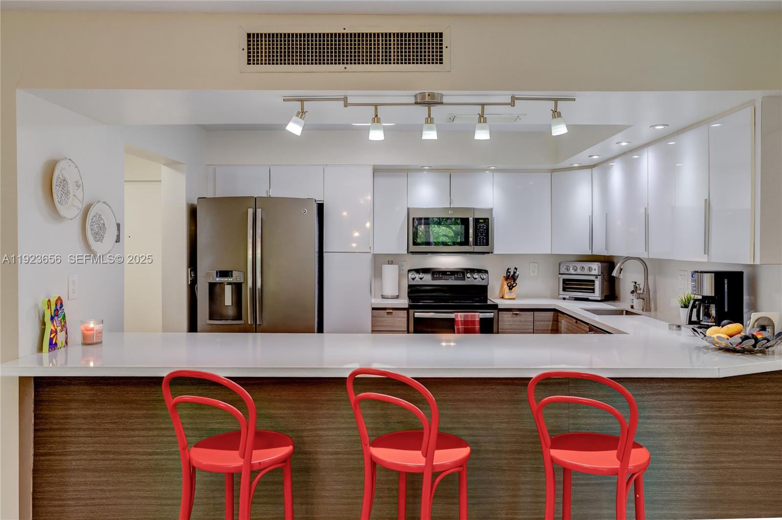 55 Ocean Ln Drive, Unit 2033 Key Biscayne, FL 33149 - Photo 7 of 21 a kitchen with stainless steel appliances granite countertop a sink and refrigerator
