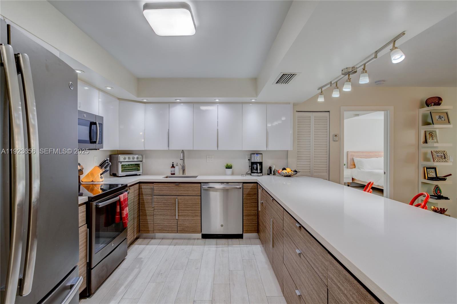 55 Ocean Ln Drive, Unit 2033 Key Biscayne, FL 33149 - Photo 9 of 21 a kitchen with a sink cabinets and stainless steel appliances