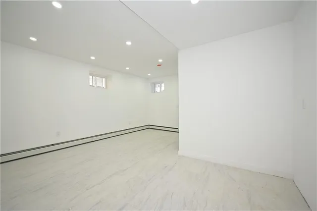 an empty room with white walls and white doors