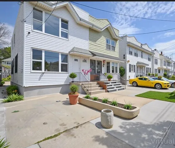a outdoor living space with patio furniture and a potted plant