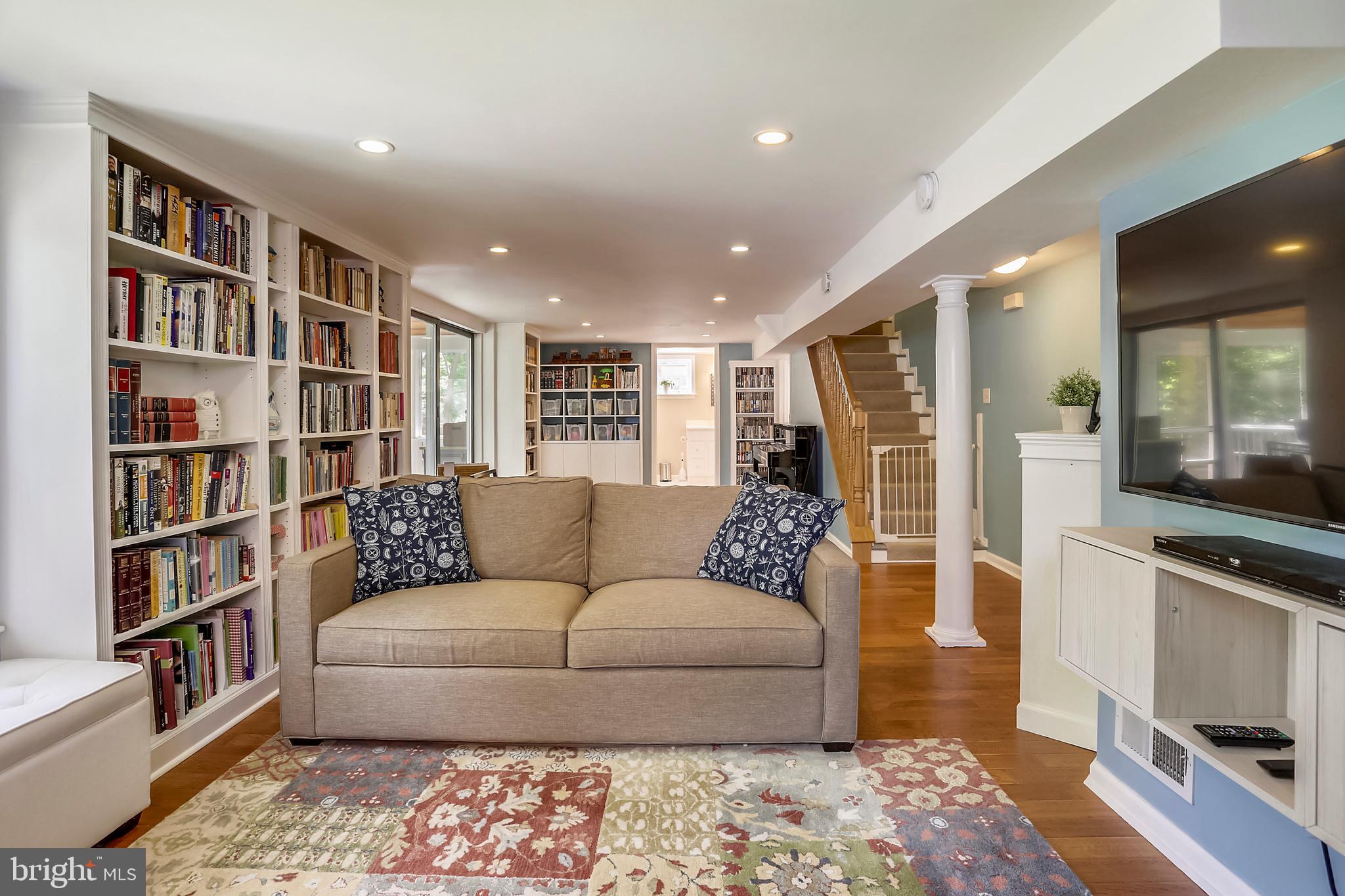 314 Penwood Road Silver Spring, MD 20901 - Photo 24 of 39 Built in bookshelves, recessed lighting & hardwood