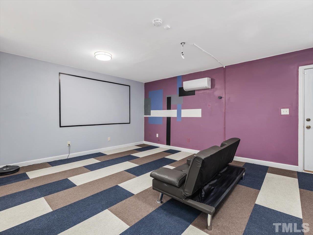 115 Inverness Court Cary, NC 27511 - Photo 12 of 25 a living room with furniture and a flat screen tv
