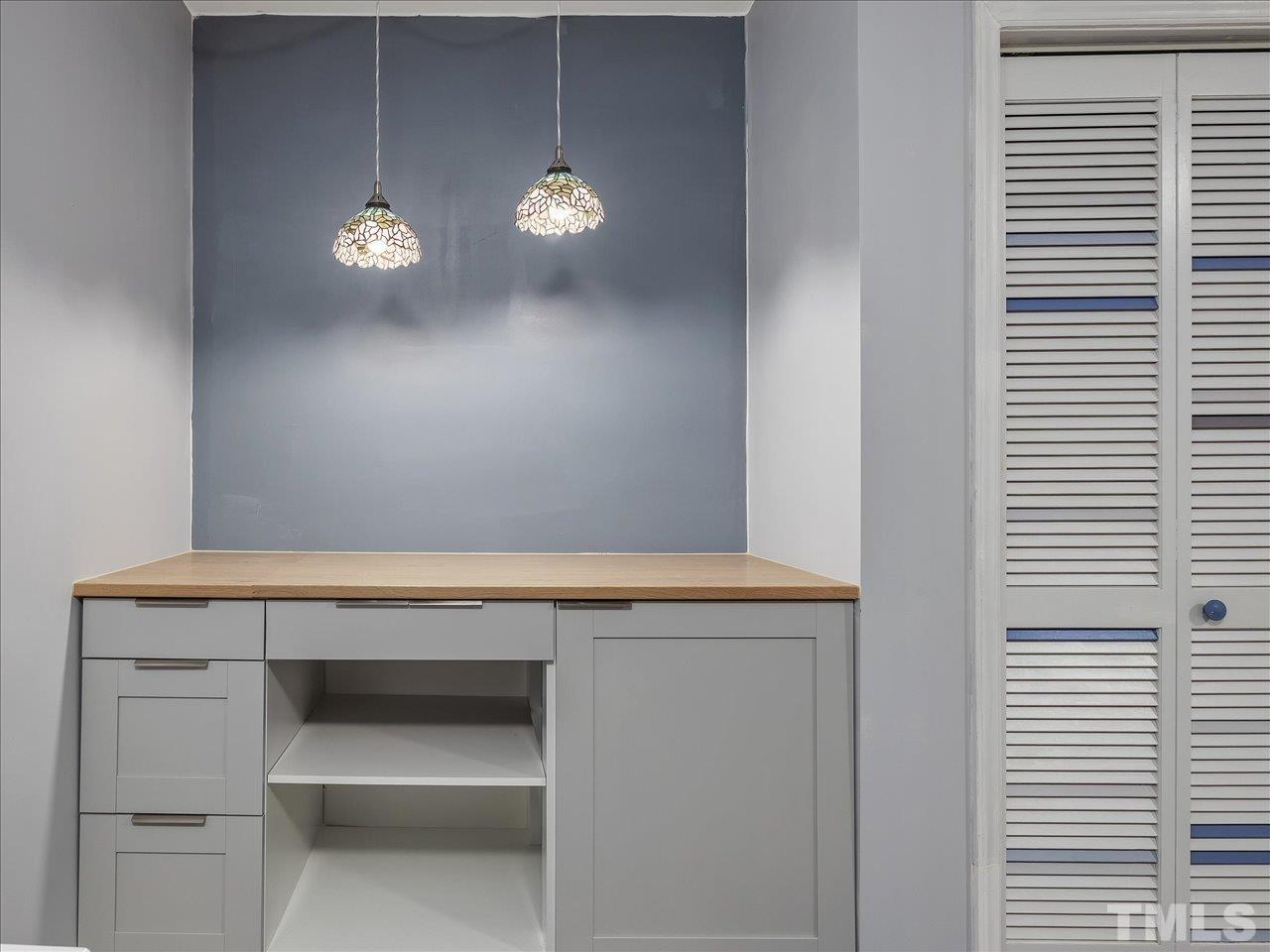 115 Inverness Court Cary, NC 27511 - Photo 15 of 25 a view of room with cabinets and wooden floor