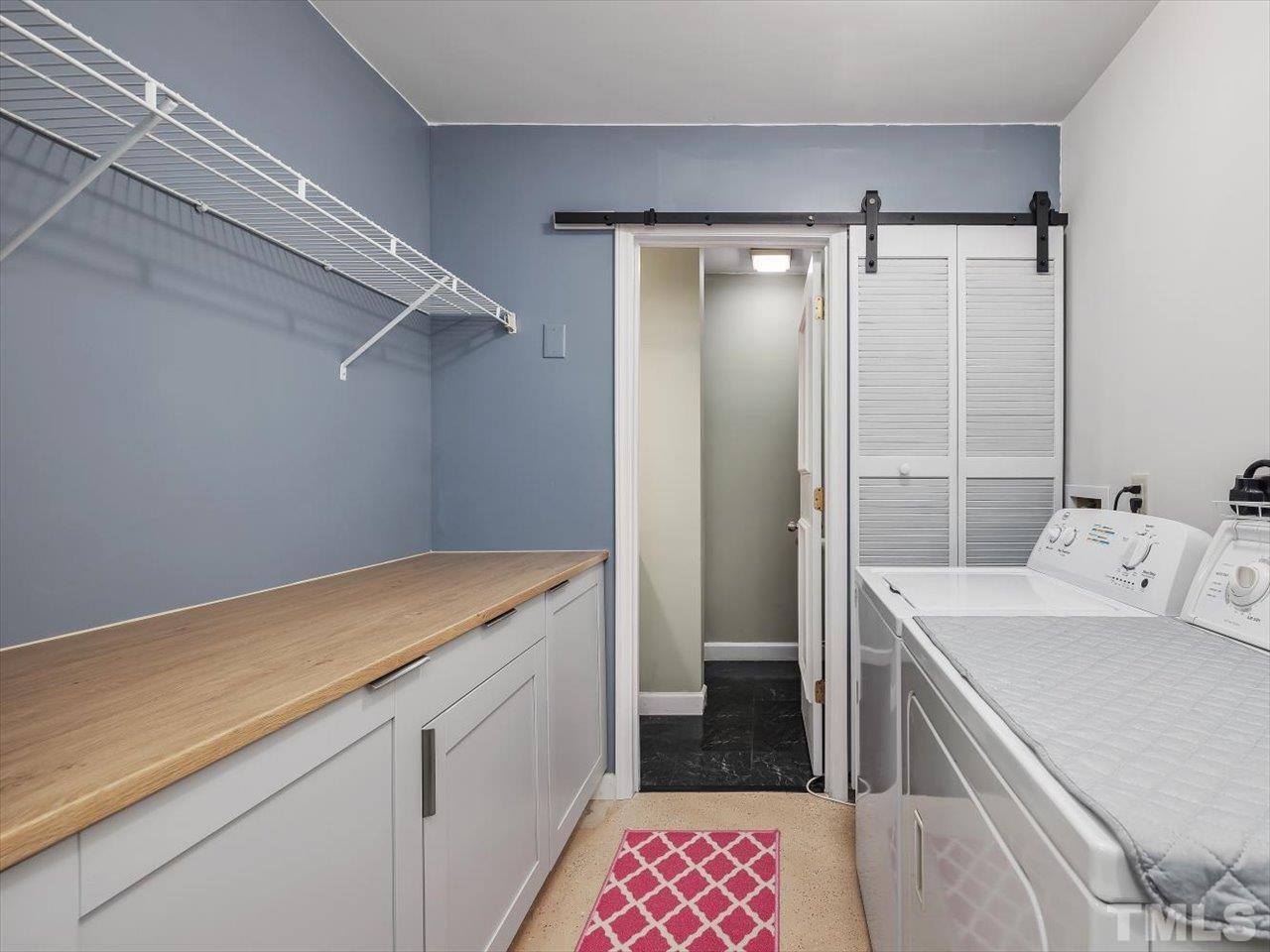 115 Inverness Court Cary, NC 27511 - Photo 16 of 25 a utility room with a sink dryer and washer
