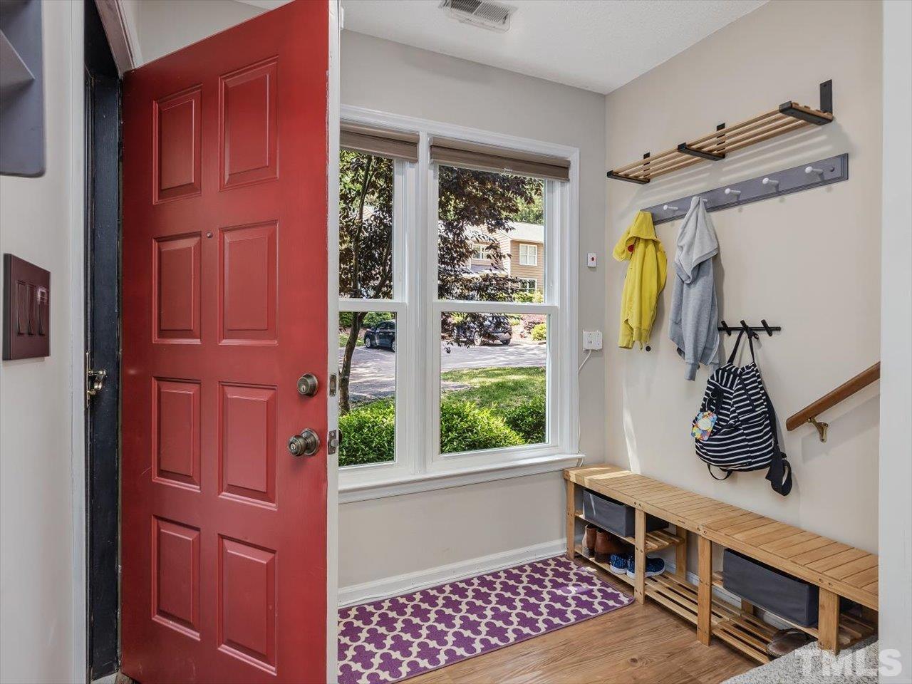 115 Inverness Court Cary, NC 27511 - Photo 3 of 25 a view of walk in closet with clothes and shoes
