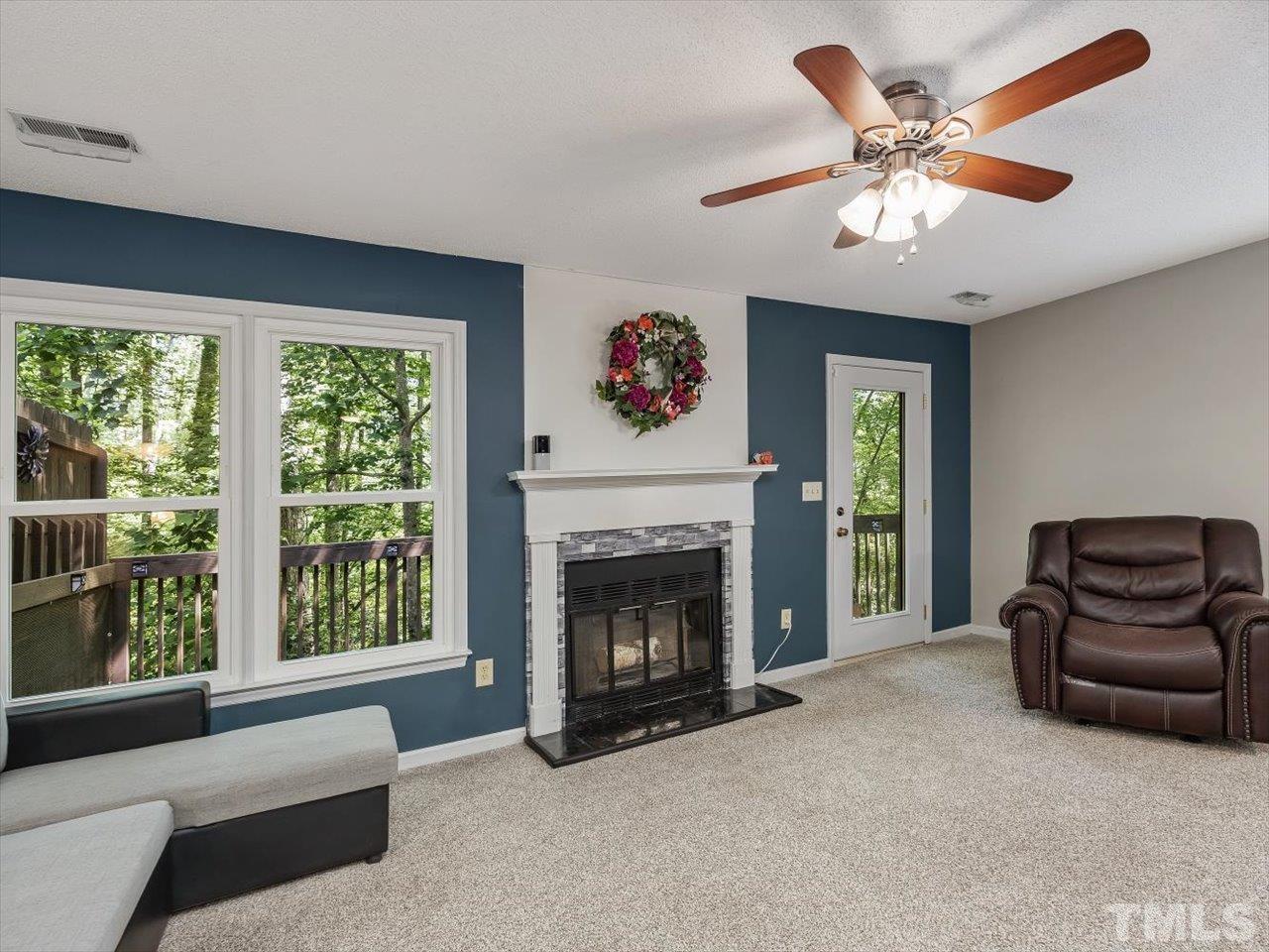 115 Inverness Court Cary, NC 27511 - Photo 4 of 25 a living room with furniture and a fireplace