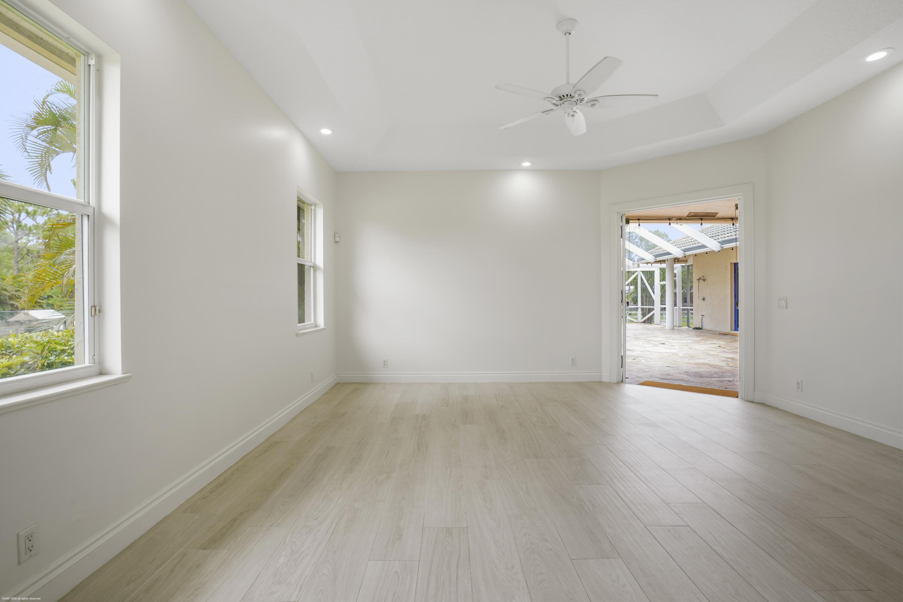 2560 Buck Ridge Trail Loxahatchee, FL 33470 - Photo 25 of 65 Primary Suite opens to pool & patio