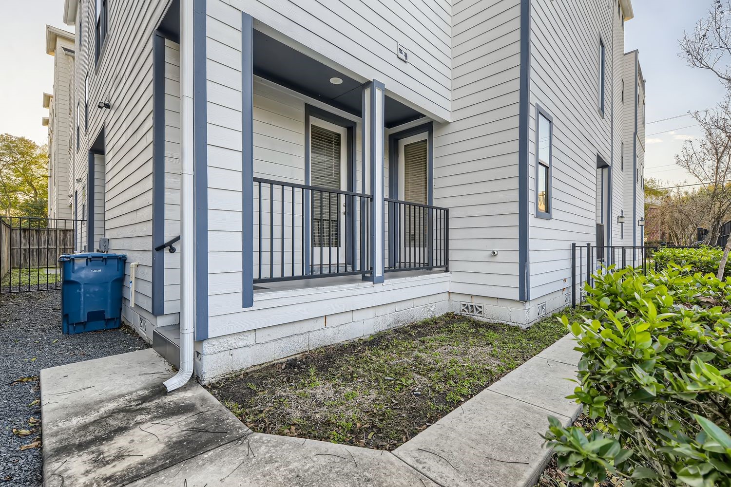 2208 Arabelle Street Houston, TX 77007 - Photo 23 of 26 a view of a house with brick walls and a bench
