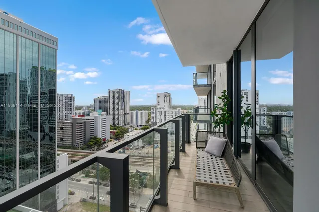 a view of balcony with furniture