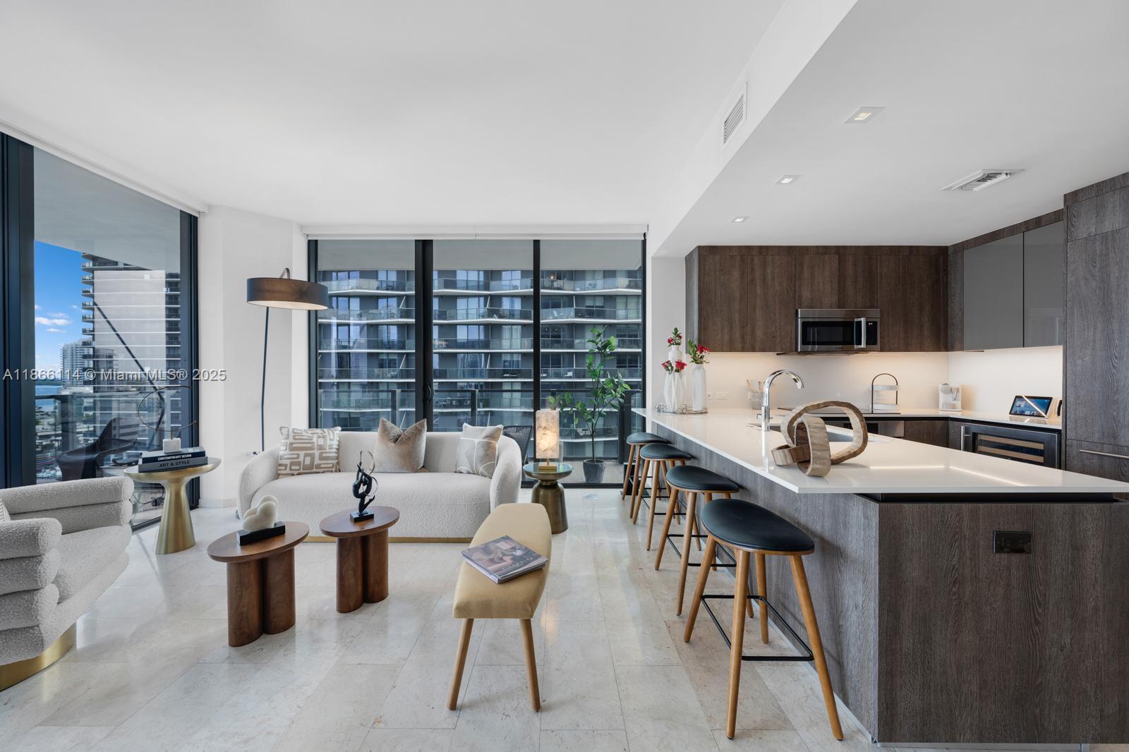88 Southwest 7th Street, Unit 1401 Miami, FL 33130 - Photo 6 of 35 a living room with furniture a flat screen tv and a large window