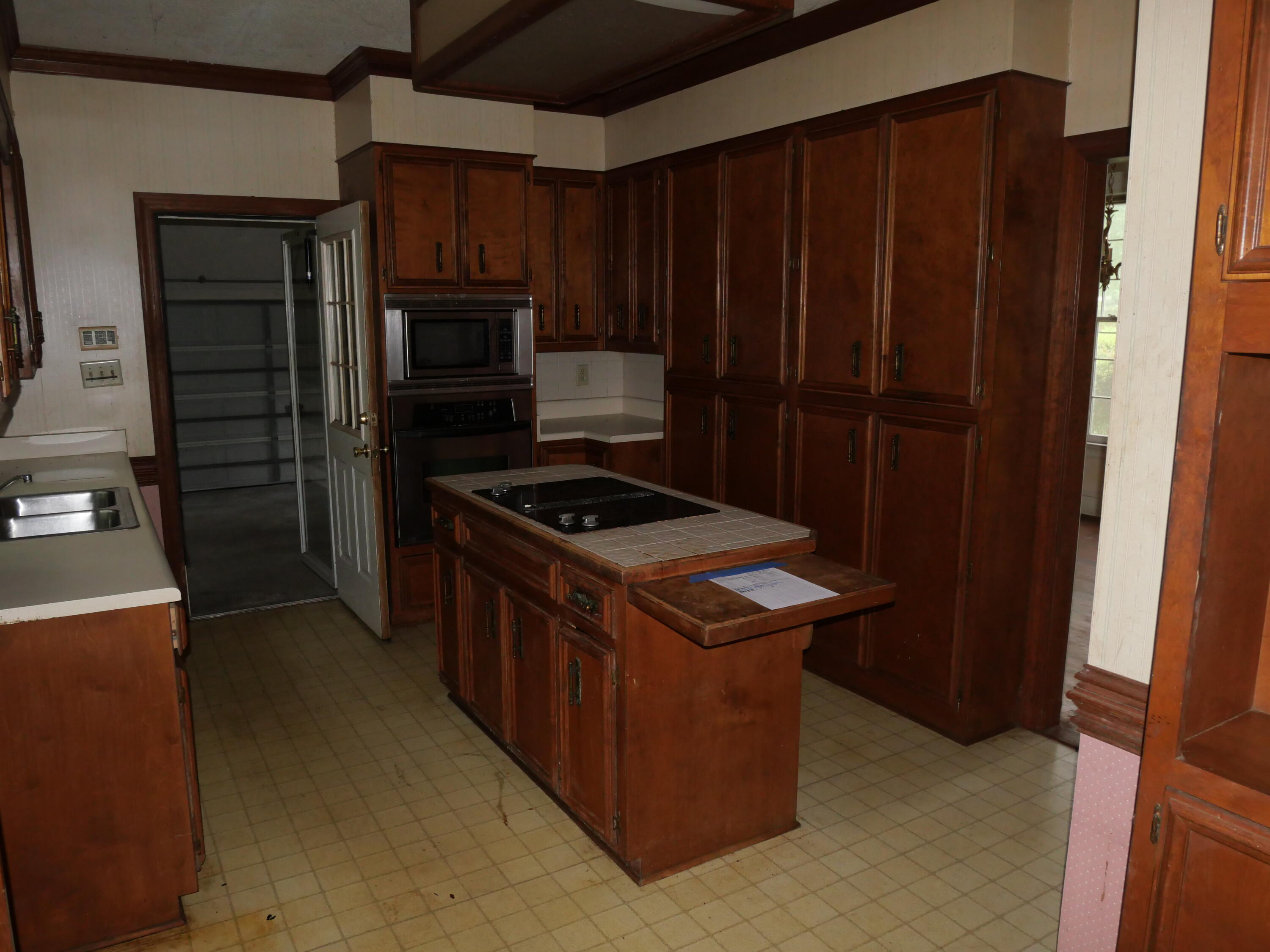 microwave, wall oven, lots of cabinetry