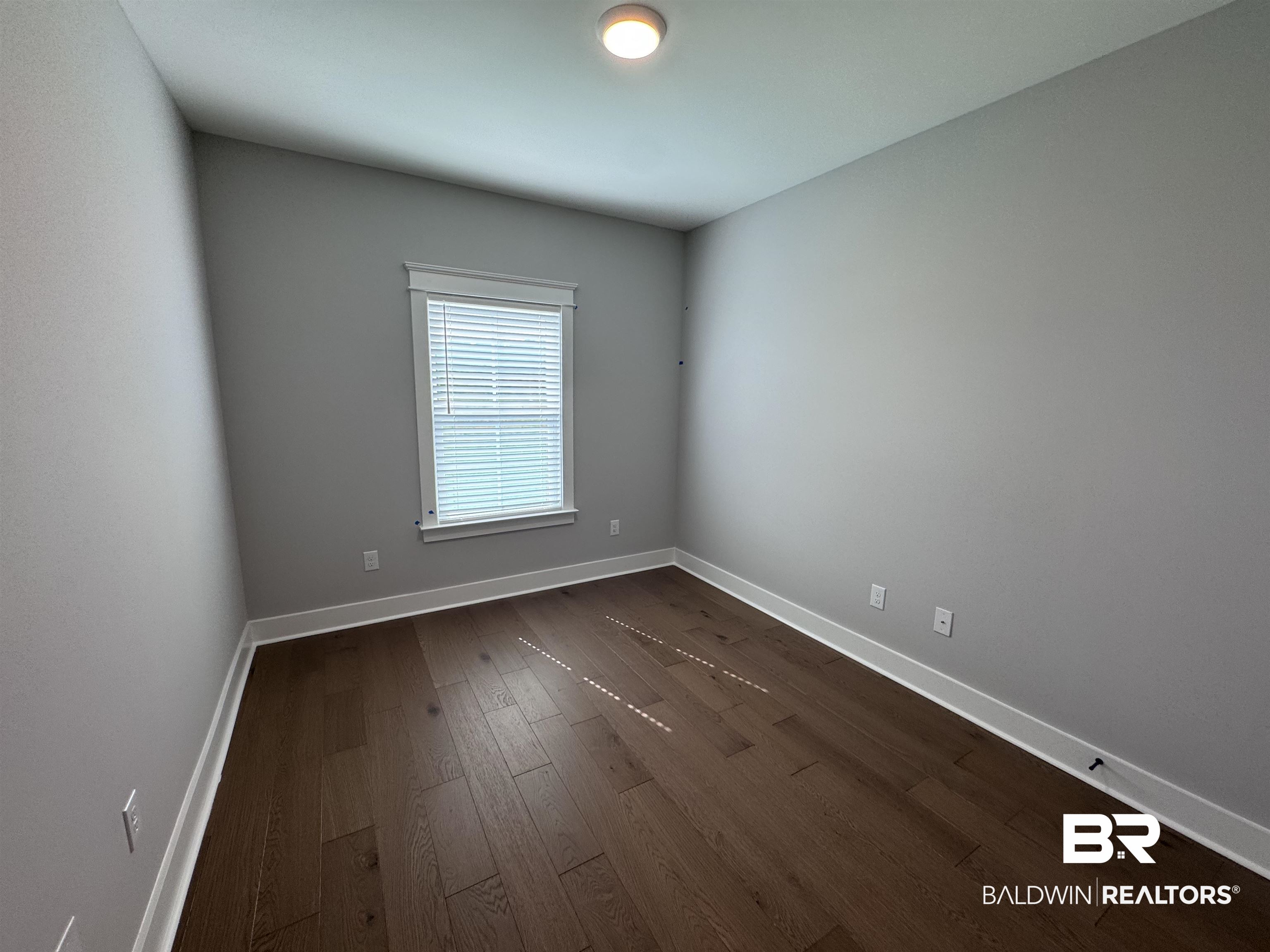 27371 Patch Pl Loop Daphne, AL 36526 - Photo 41 of 63 Unfurnished room with baseboards and dark wood finished floors