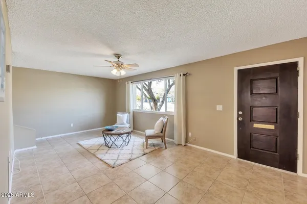 a living room with furniture and window