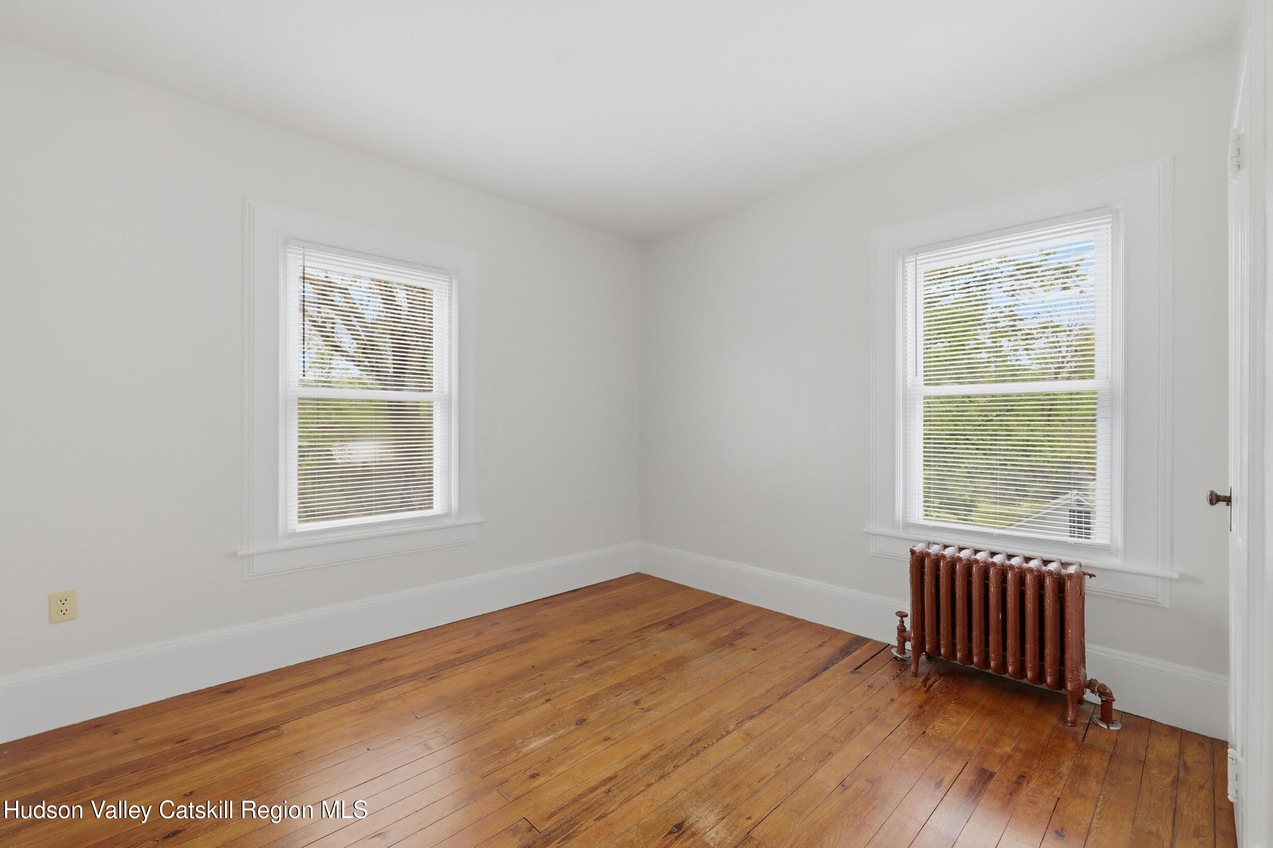 294 Kyserike Road Accord, NY 12404 - Photo 20 of 46 an empty room with wooden floor and windows