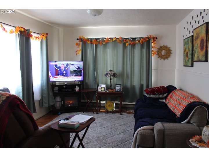 848 N Street Springfield, OR 97477 - Photo 28 of 33 a living room with furniture and a flat screen tv