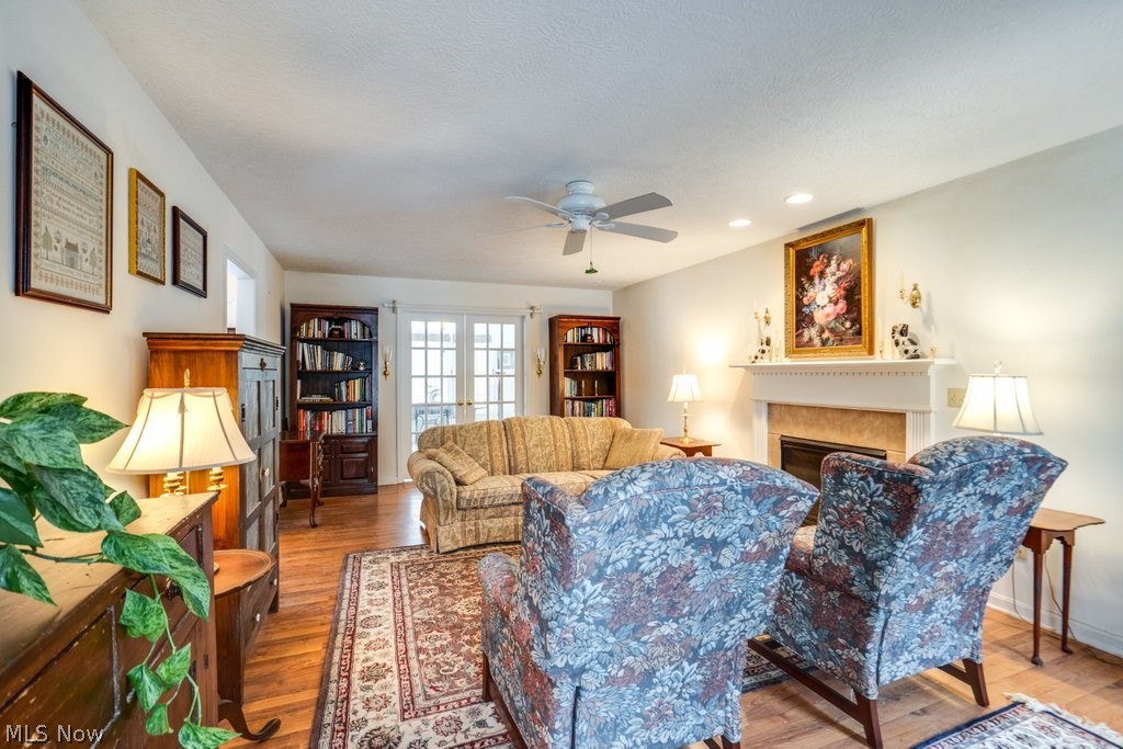 136 Taylor Road Barberton, OH 44203 - Photo 24 of 45 Living room with wood finished floors, ceiling fan, a fireplace, french doors, and recessed lighting