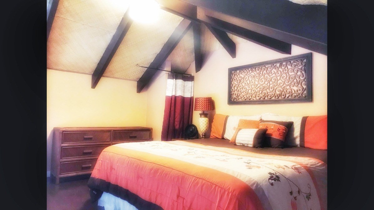 4480 Ka Haku Road, Unit 208 Princeville, HI 96722 - Photo 12 of 28 a bedroom with a bed and window
