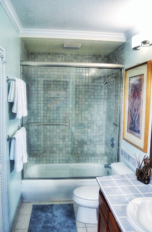 4480 Ka Haku Road, Unit 208 Princeville, HI 96722 - Photo 19 of 28 a bathroom with a sink toilet and shower