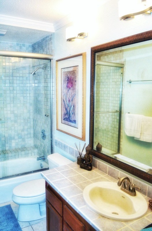 4480 Ka Haku Road, Unit 208 Princeville, HI 96722 - Photo 20 of 28 a bathroom with a granite countertop sink toilet and shower