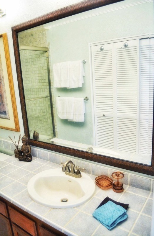 4480 Ka Haku Road, Unit 208 Princeville, HI 96722 - Photo 23 of 28 a bathroom with a sink and a mirror