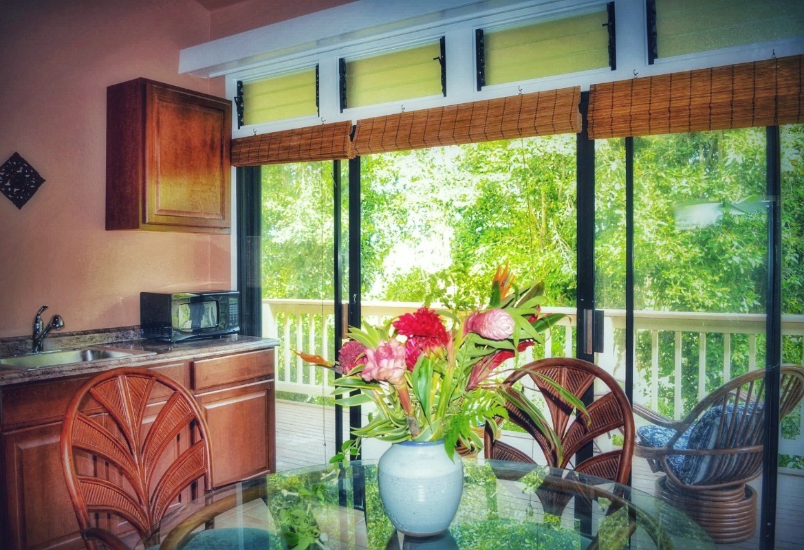 4480 Ka Haku Road, Unit 208 Princeville, HI 96722 - Photo 26 of 28 a dining room with furniture garden view and a potted plant