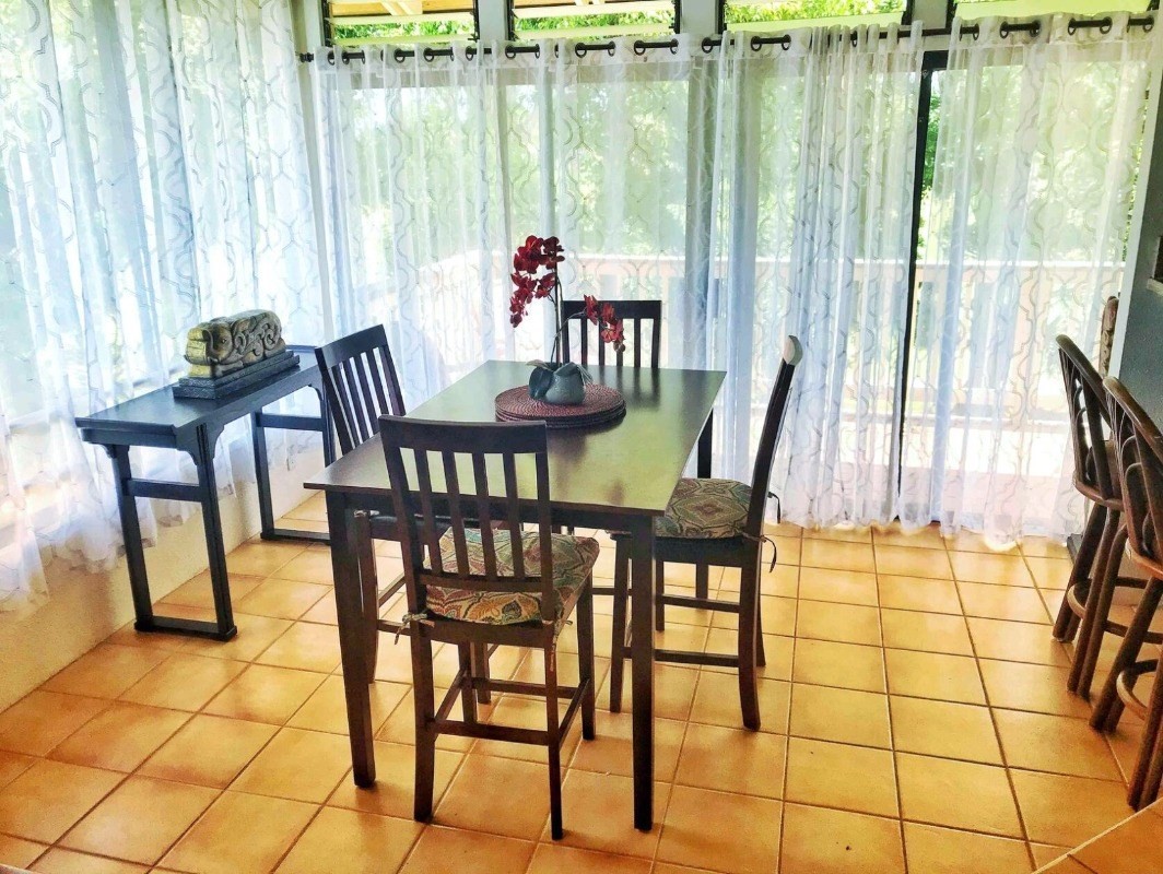 4480 Ka Haku Road, Unit 208 Princeville, HI 96722 - Photo 8 of 28 a view of a dining room with furniture and a window