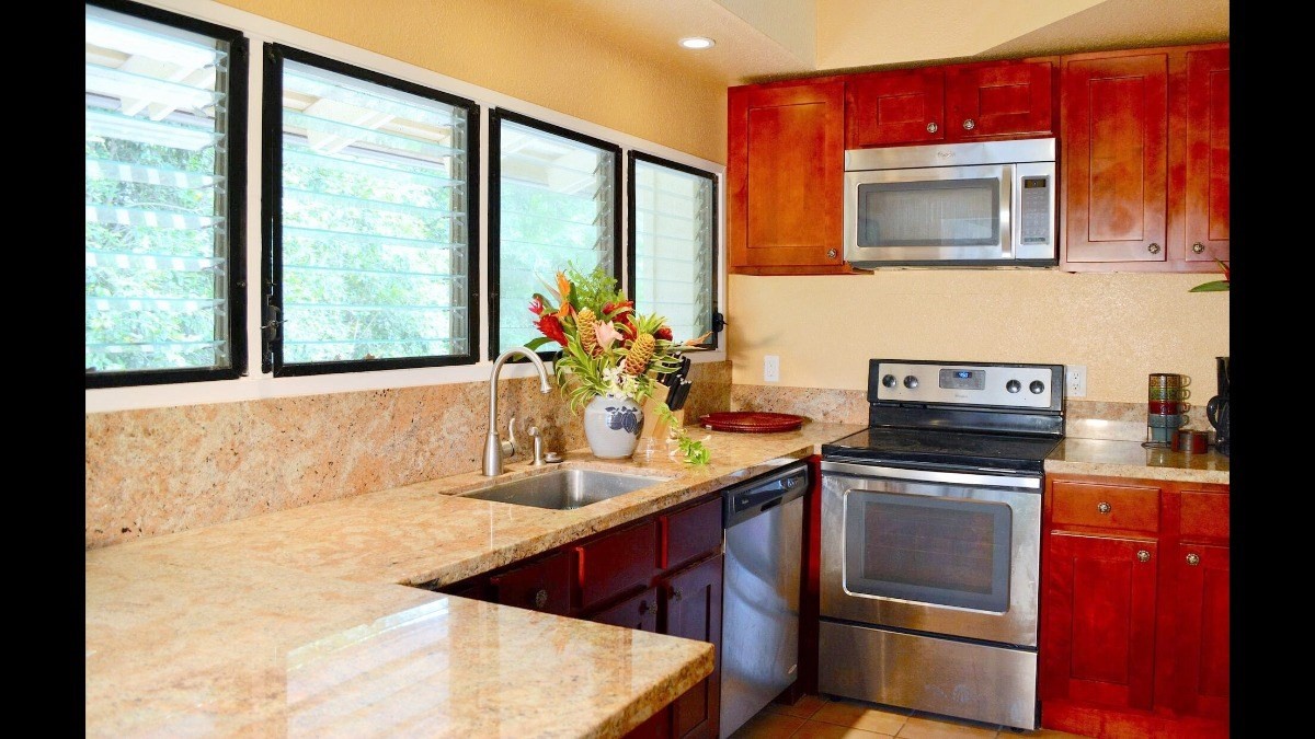 4480 Ka Haku Road, Unit 208 Princeville, HI 96722 - Photo 10 of 28 a kitchen with a sink stove and microwave