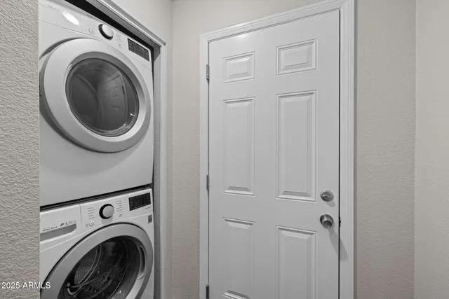 a view of a hallway with washer and dryer