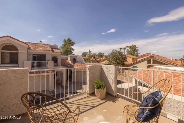 a view of a house with backyard and porch