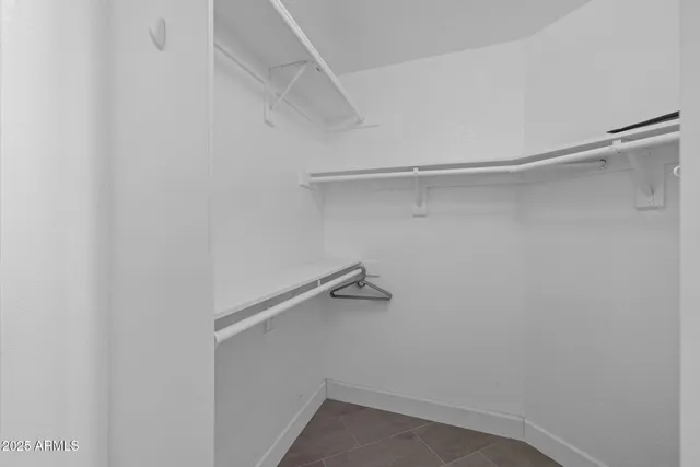 a view of an empty walk in closet