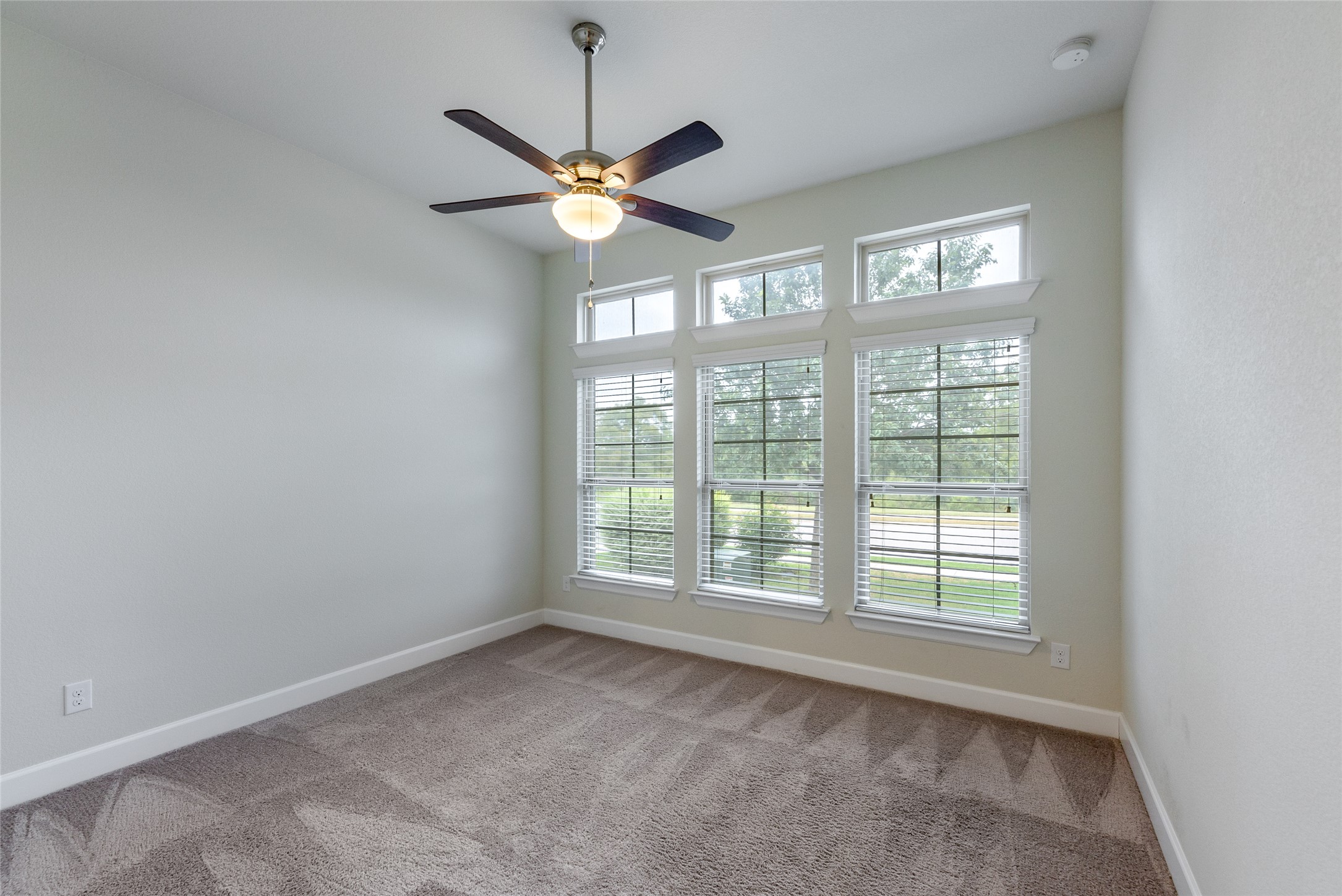 3043 Hidalgo Loop Round Rock, TX 78665 - Photo 16 of 34 Spare room featuring light carpet and ceiling fan