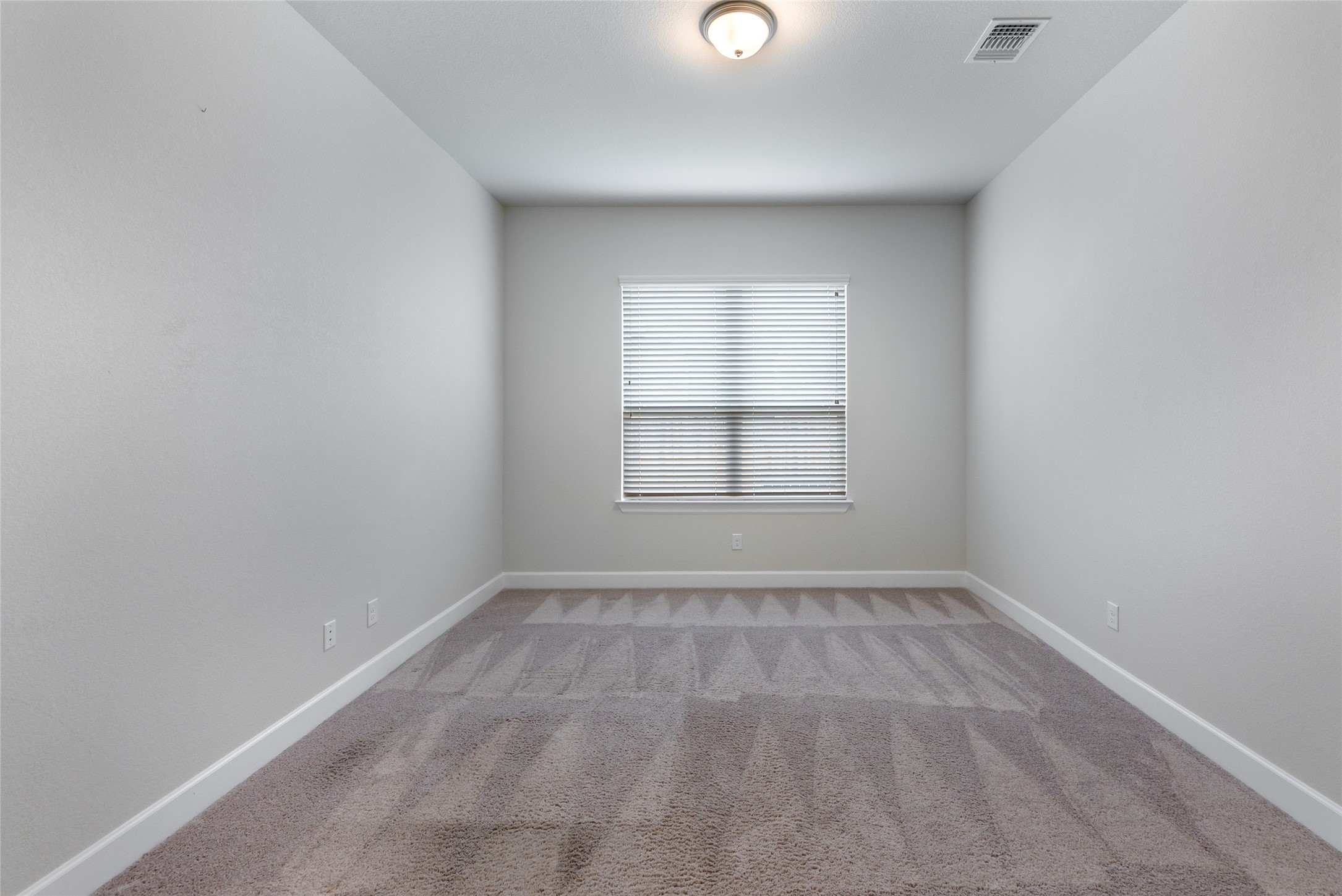 3043 Hidalgo Loop Round Rock, TX 78665 - Photo 21 of 34 Spare room with light carpet and baseboards