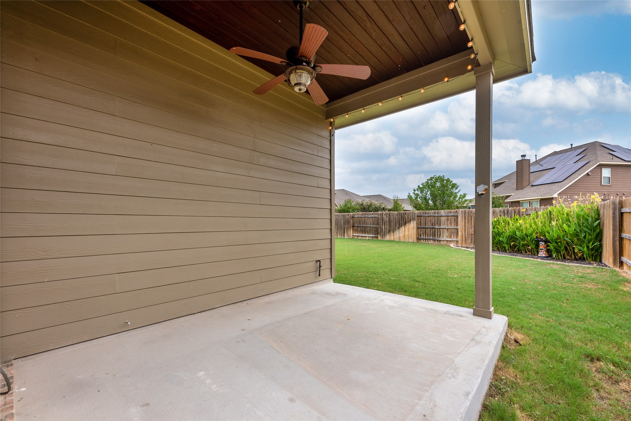 3043 Hidalgo Loop Round Rock, TX 78665 - Photo 28 of 34 Fenced backyard with ceiling fan and a patio area