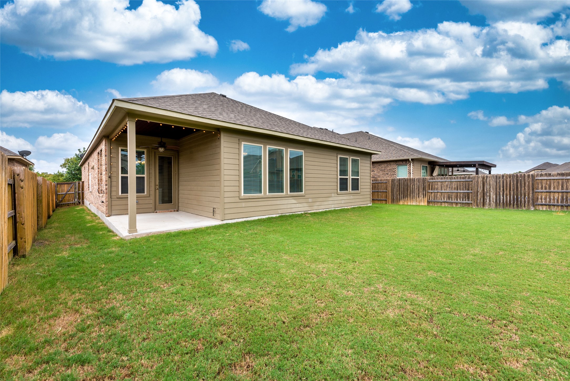 3043 Hidalgo Loop Round Rock, TX 78665 - Photo 29 of 34 Back of property with a patio, a fenced backyard, a ceiling fan, and a shingled roof