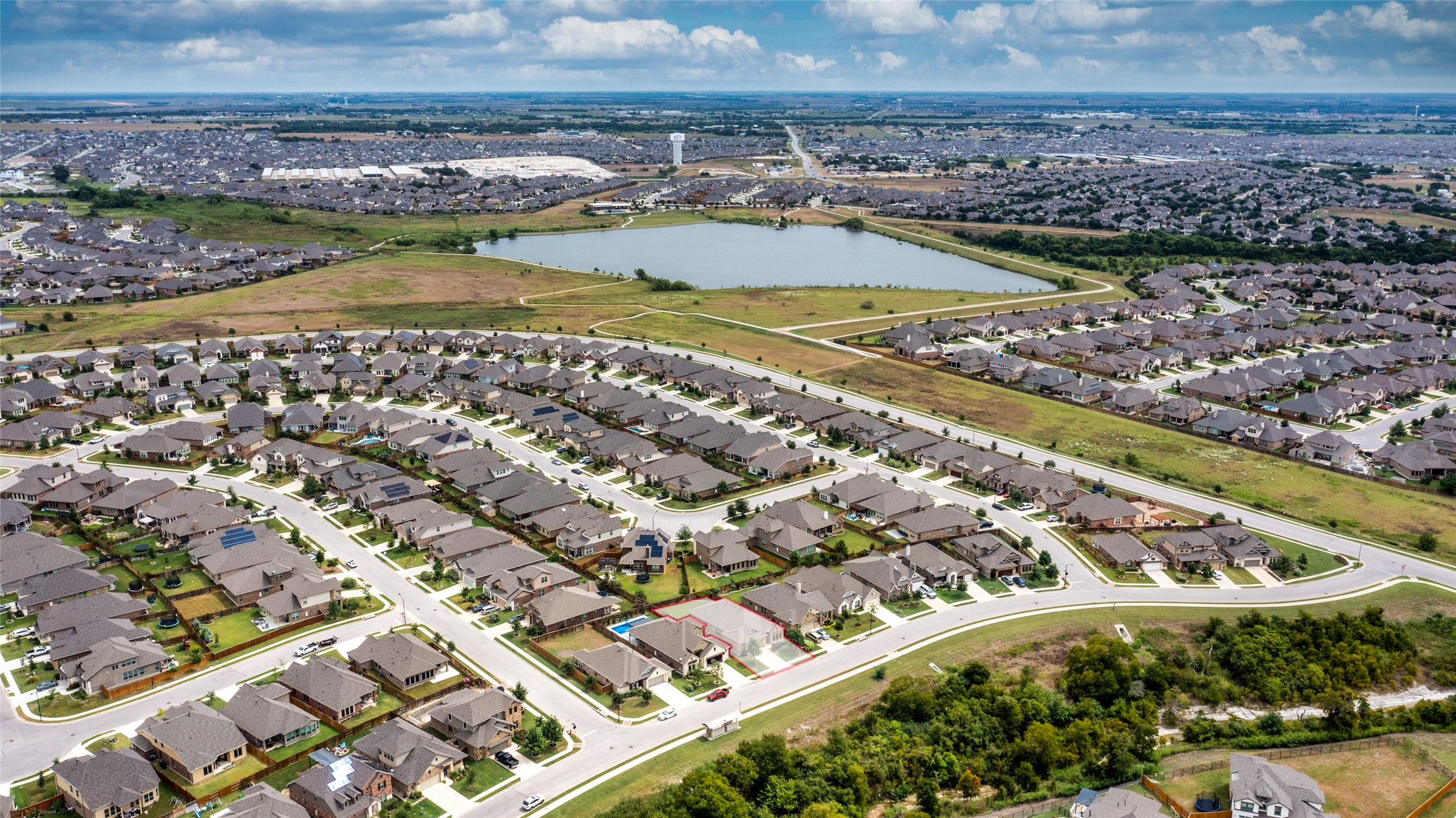 3043 Hidalgo Loop Round Rock, TX 78665 - Photo 31 of 34 Aerial perspective of suburban area featuring a nearby body of water
