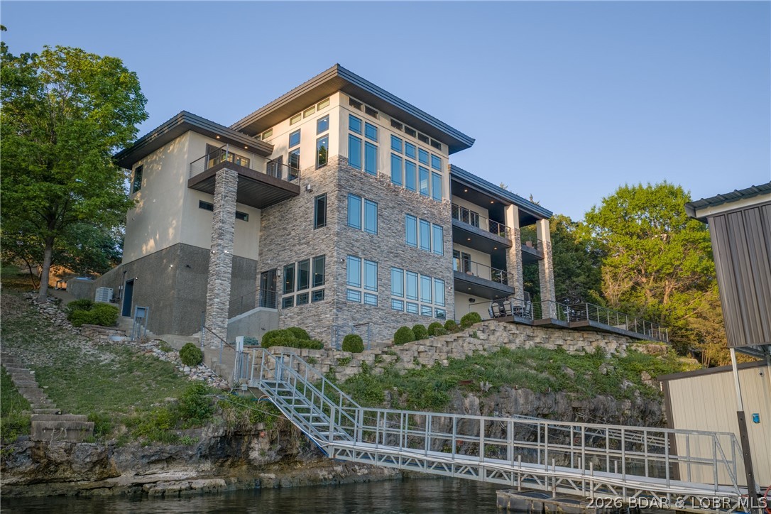 777 Malibu Road Osage Beach, MO 65065 - Photo 81 of 100 The pool and dock are perfectly connected with an