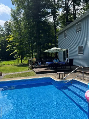 a view of a house with a swimming pool