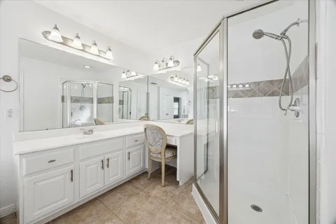 a bathroom with a double vanity sink mirror and double