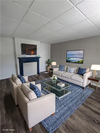 a living room with furniture and a rug