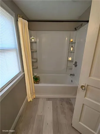 a bathroom with a bath tub
