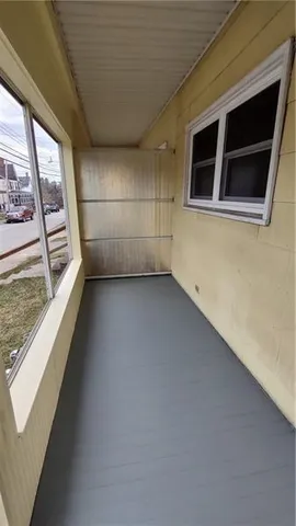 a kitchen with granite countertop a sink stove and refrigerator