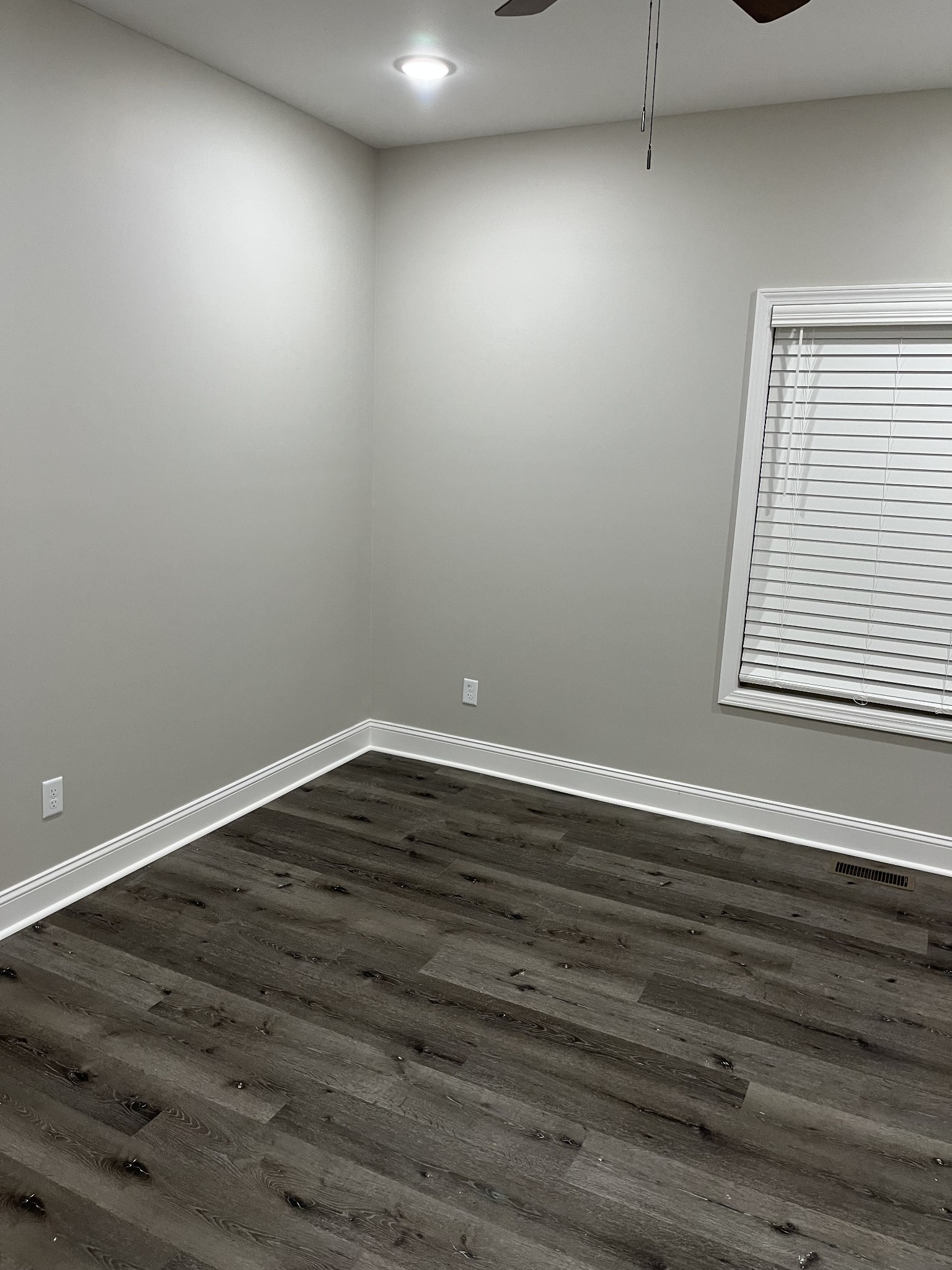 9970 West Green Cemetery Road Bon Aqua, TN 37025 - Photo 7 of 8 a view of an empty room with wooden floor and a window